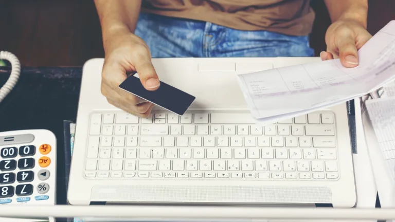 a person using a computer and learning how to Close a Bank Account.