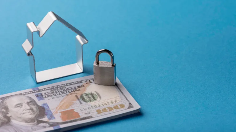 Illustrative image of Secured Loans with miniature house, padlock and money.