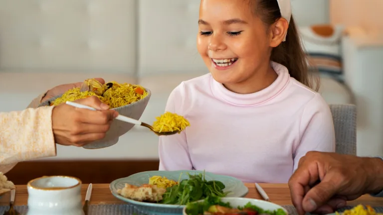 A little girl enjoying US Food Stamps Program.