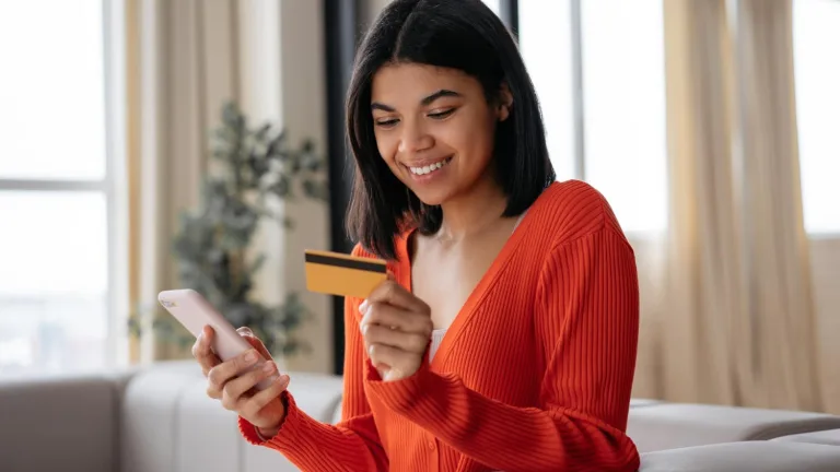 Woman doing her part in Credit card spending trends.
