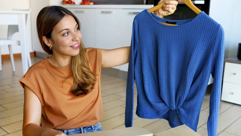 woman getting clothing from shein.