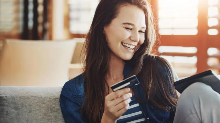 Happy woman with Bank of America 10% card rate.