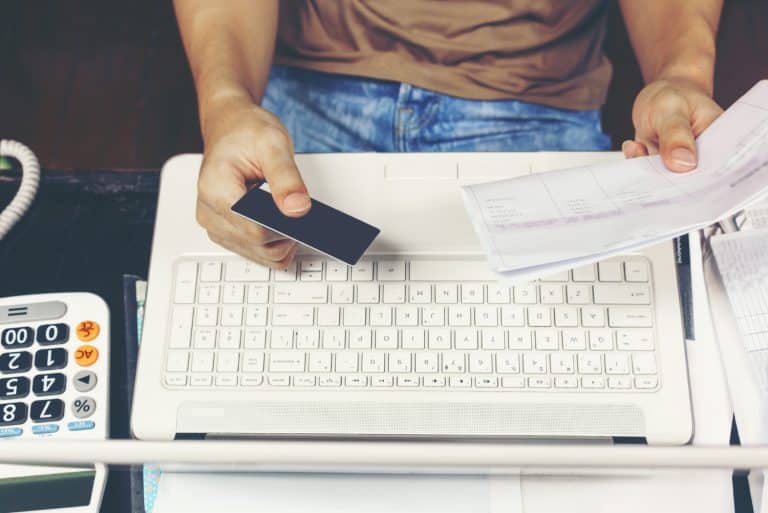 a person using a computer and learning how to Close a Bank Account.
