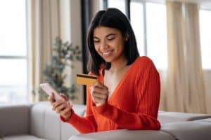 Woman doing her part in Credit card spending trends.