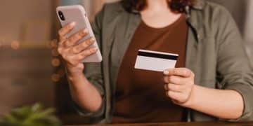 woman thinking about UK credit card spending slowdown.