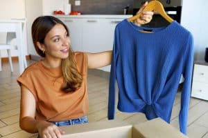 woman getting clothing from shein.
