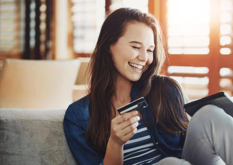 Happy woman with Bank of America 10% card rate.